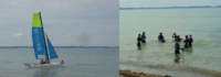 Segelboot im Meer und Kinder planschen im Wasser