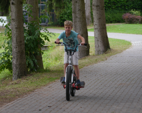 Junge auf dem Fahhrad in Feriencamps Münster