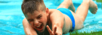 Schnuppercamp, Kind auf der Wasserrutsche